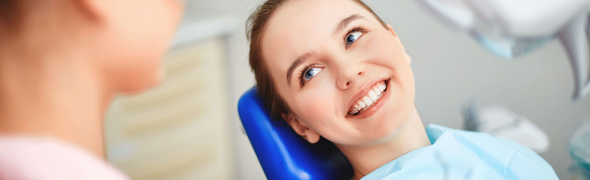 smiling woman sitting in a dental chair