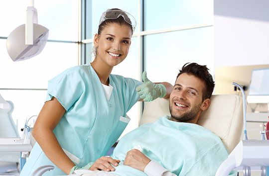 dental staff member and a patient