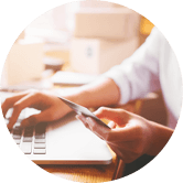 person using phone and computer